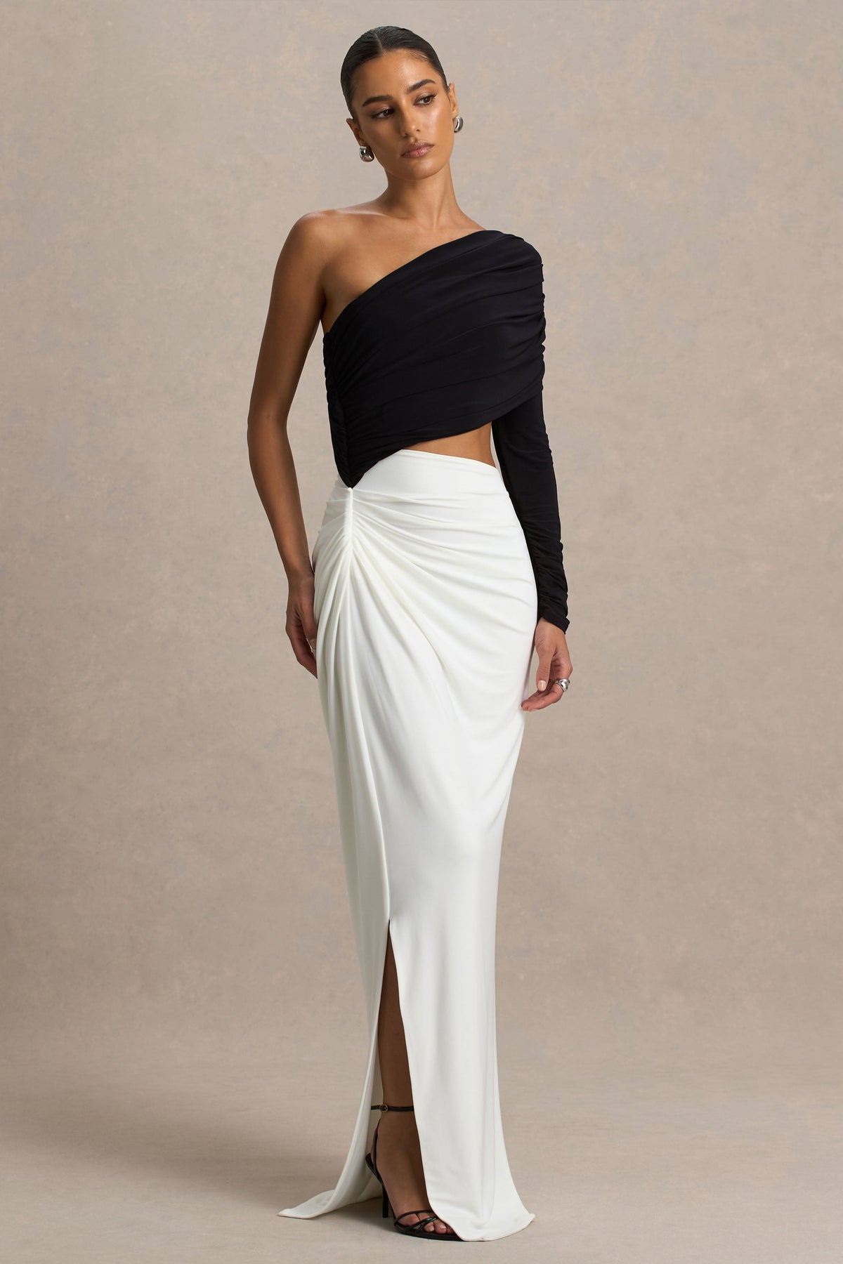 Malika | Black and White Asymmetric-Neck Maxi Dress with Body-Cut Out and Gathered Detailing - UK 12 Black and White Malika | Black and White Asymmetric-Neck Maxi Dress with Body-Cut Out and Gathered Detailing - UK 12 Black and White