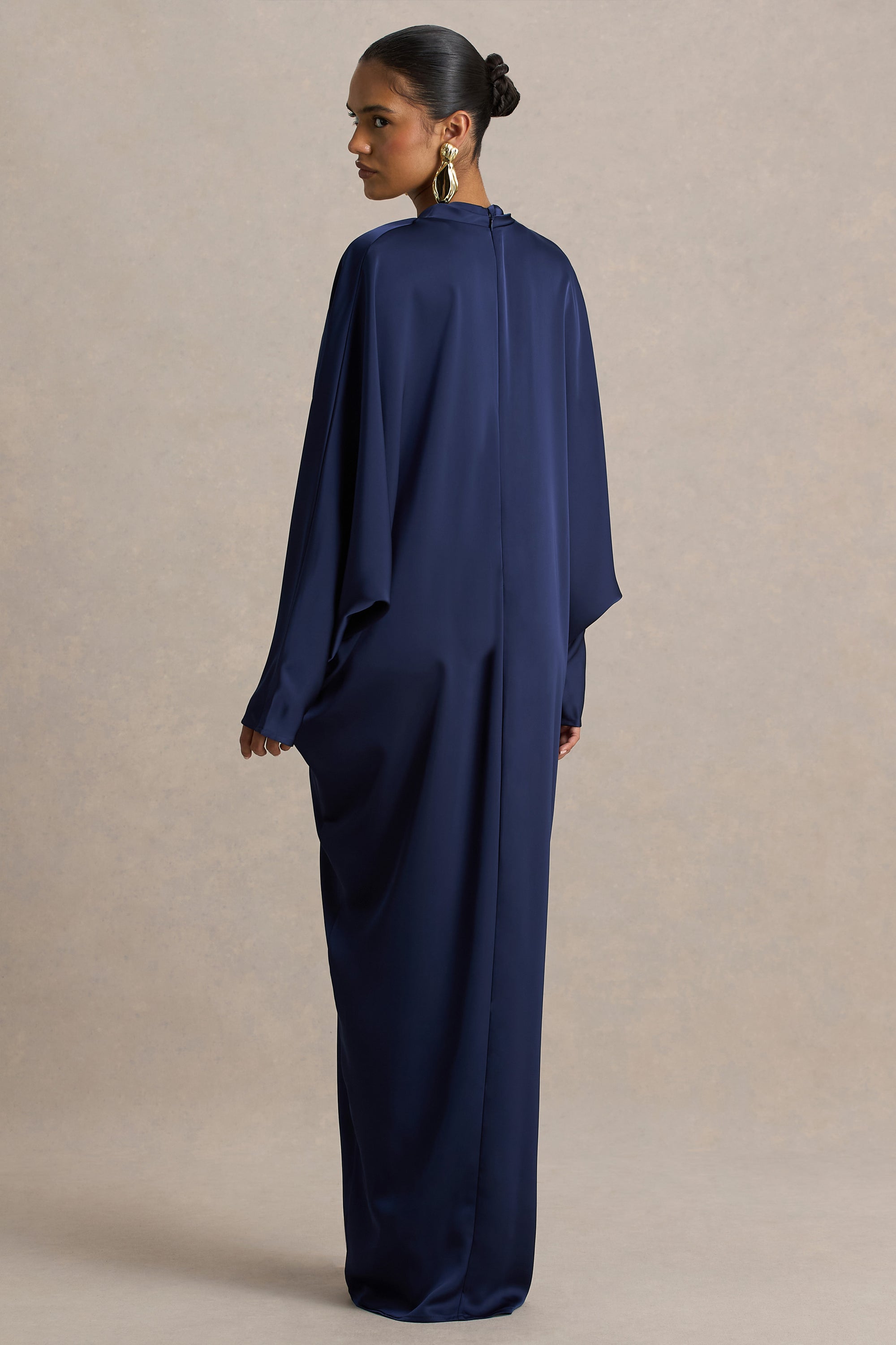 https://www.showpo.com/eu/cariela-plunge-neck-satin-maxi-dress-in-navy.html Tina | NAVY Satin Plunge-Neck Embellished Maxi Dress