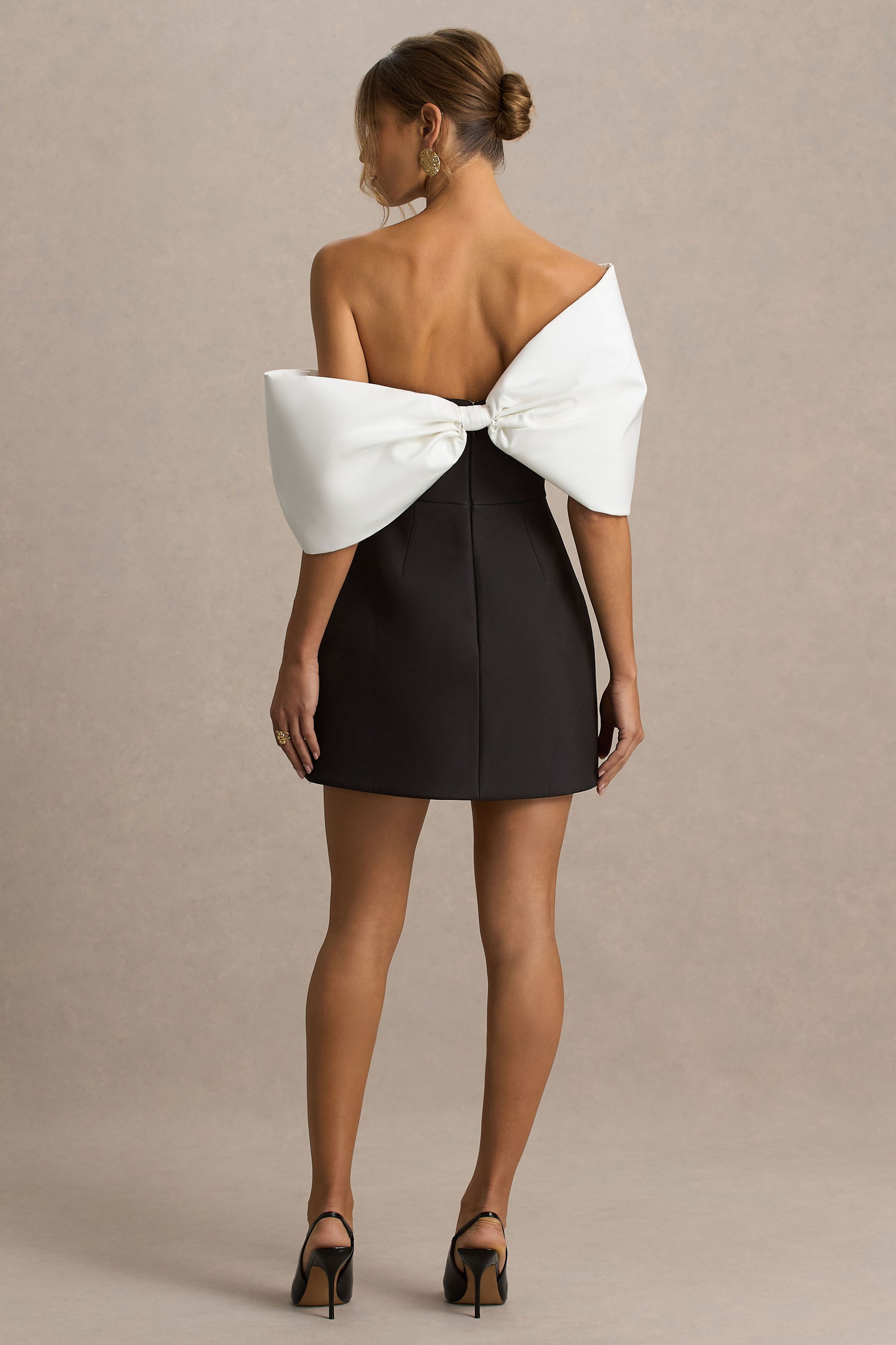 white mini dress with black bow All Tied Up White Mini Dress with Black Bow Accents chronicles